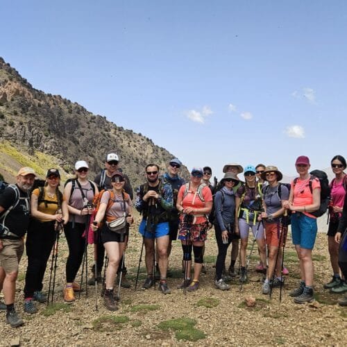Group of hikers on the 6 Day Mount Toubkal and Lake Ifni Trek in the High Atlas Mountains of Morocco with local guides from Imlil.